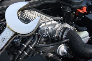 V8 supercharged car engine and spanner